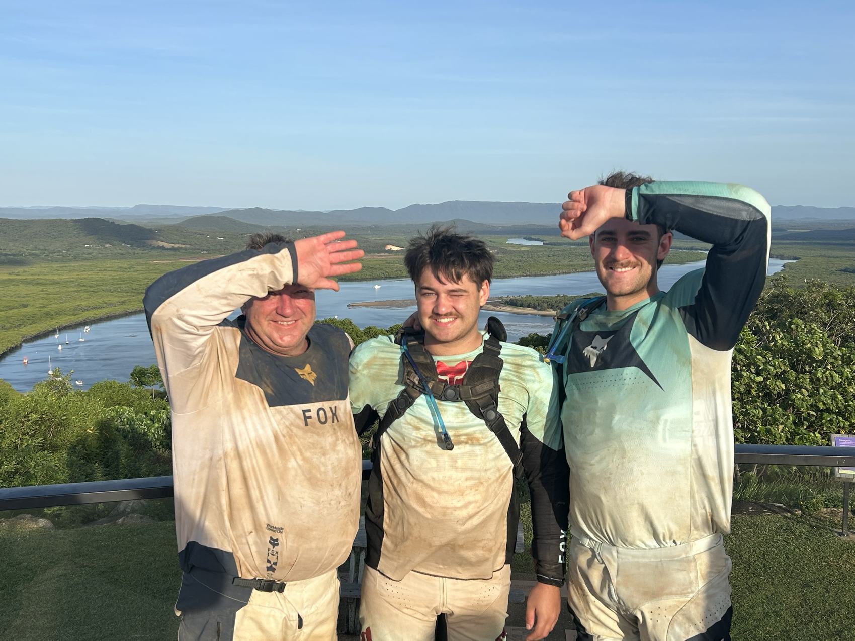 Grant, Max and Murray at a lookout over the Endeavour River, dust and mud on every inch of their gear