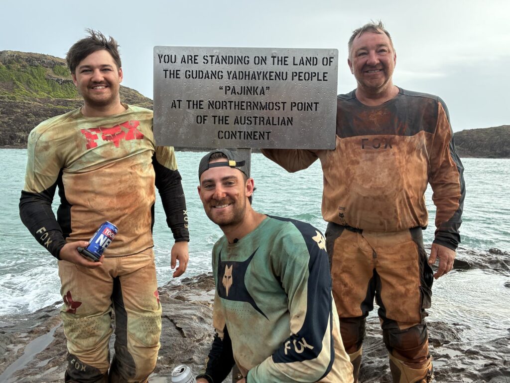 Grant and Max at the sign marking the northernmost point of mainland Australia