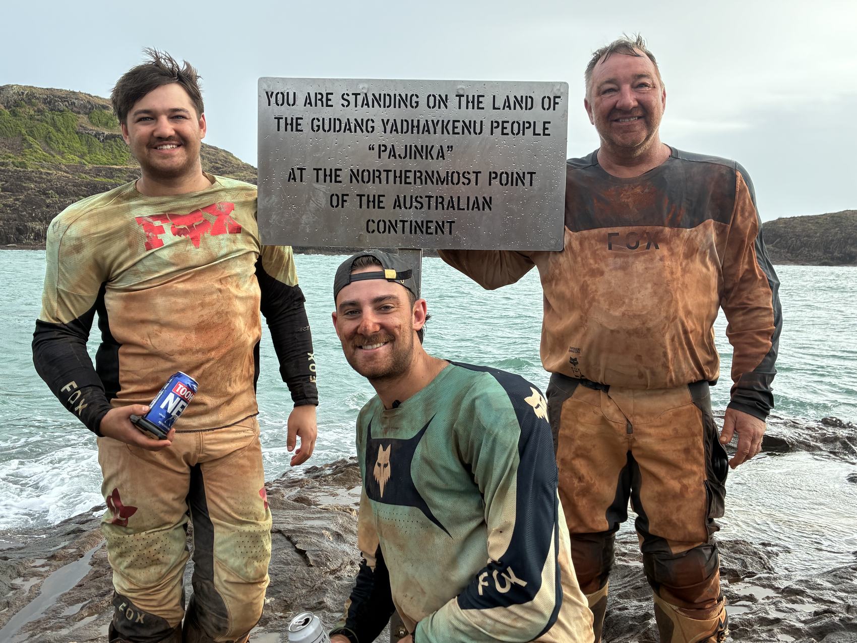 Grant and Max at the sign marking the northernmost point of mainland Australia